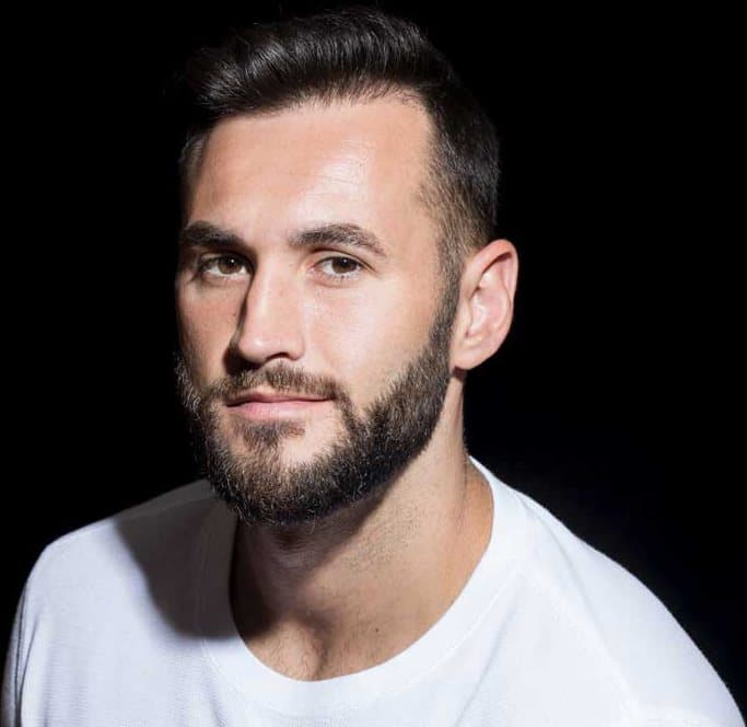 Man with a full, natural hairline following robotic hair restoration